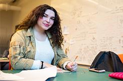 Student works at desk in Art 和 Design building